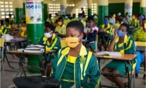 Minister of Education. Picture of students seate in class